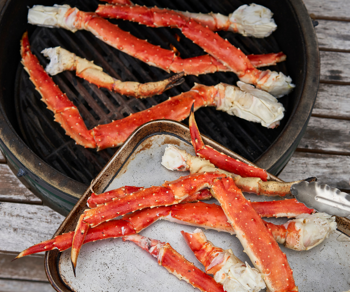 King crab legs on grill and tray