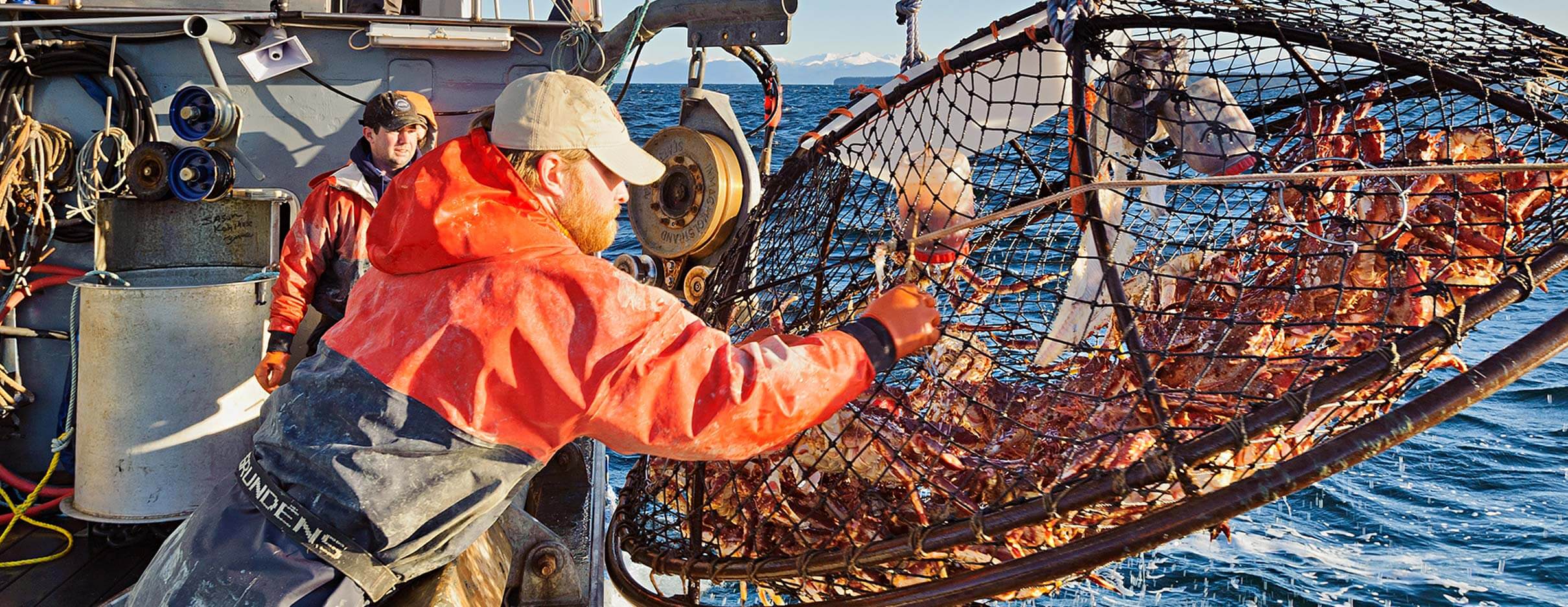 Fishermen pulling in a catch of Alaskan King Crab.