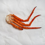 Golden king crab cluster on parchment paper
