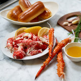 Golden king crab cluster meat on a plate with butter and lemon 