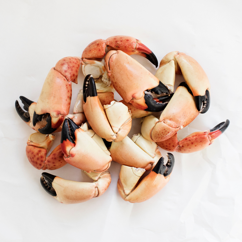 stone crab claws on butcher paper