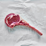 Tomahawk ribeye on parchment paper