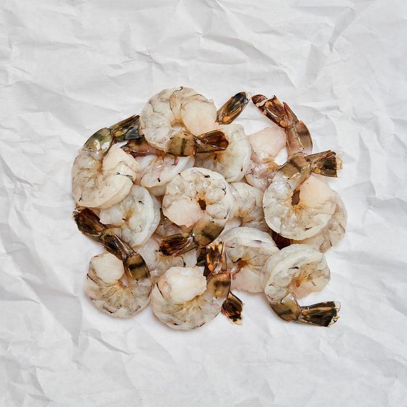 raw tiger shrimp on butcher paper